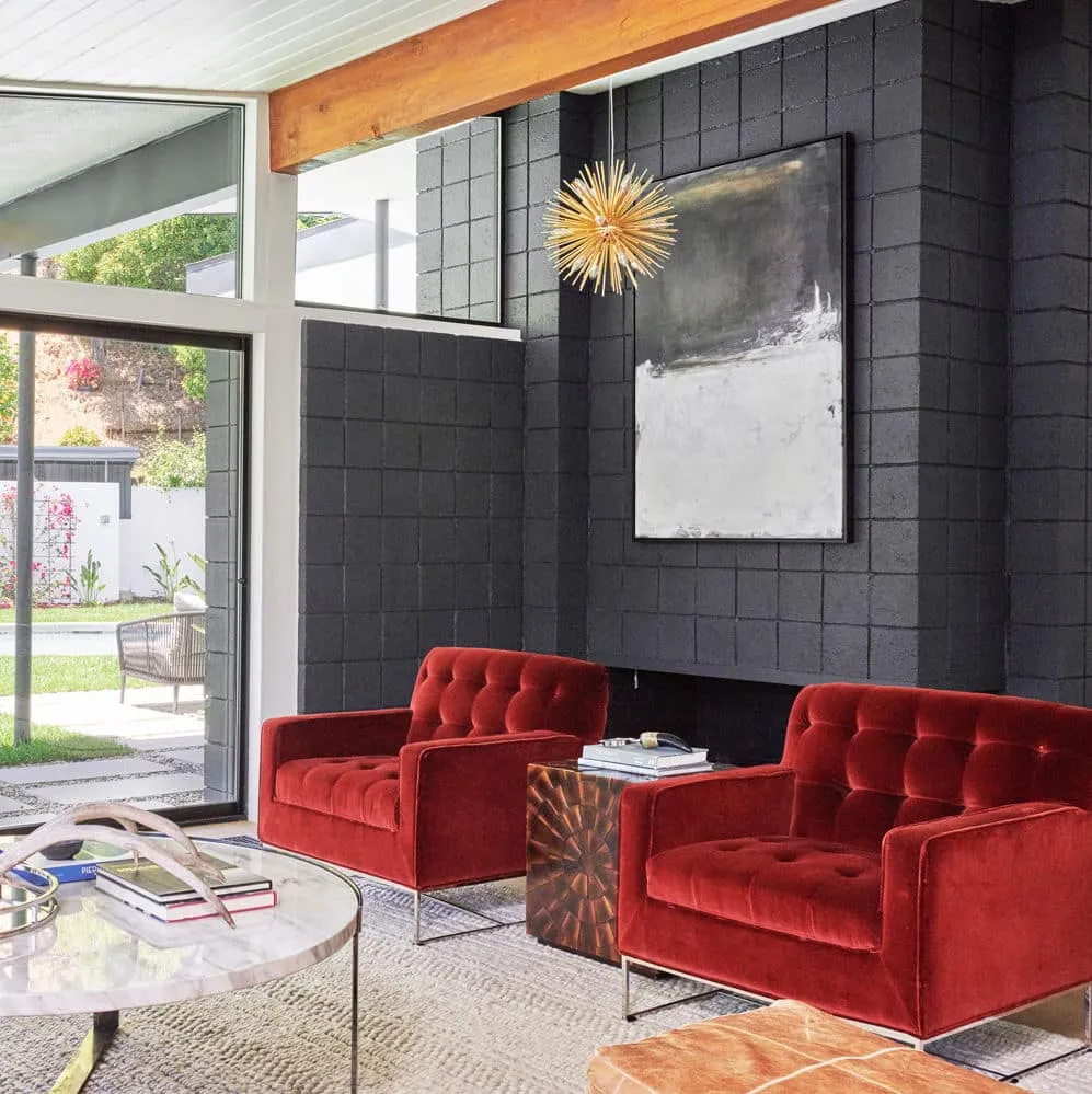 A living room filled with furniture and a fire place