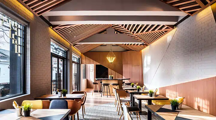 08_VUE_FABCAFE-720x400 A dining room filled with furniture and a large window