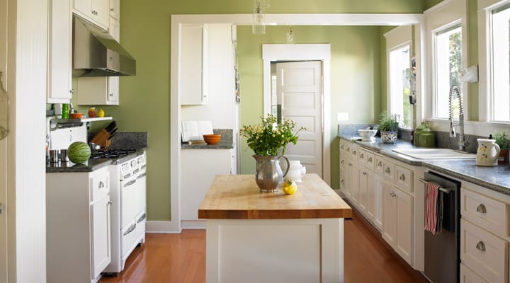 A kitchen with a sink and a window