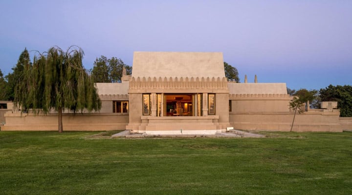 A building with a grassy field