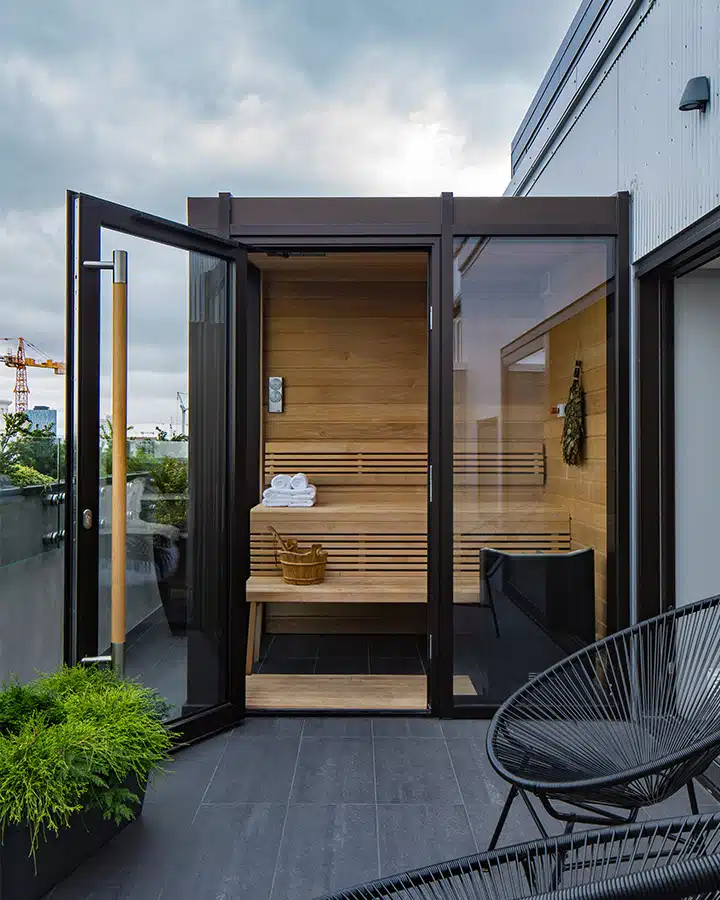 12-Junior-Suite-Sauna-and-Exterior-Balcony-720x900 A chair sitting in front of a building