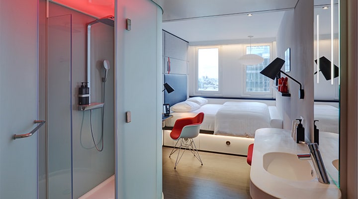 A room with a sink and a mirror