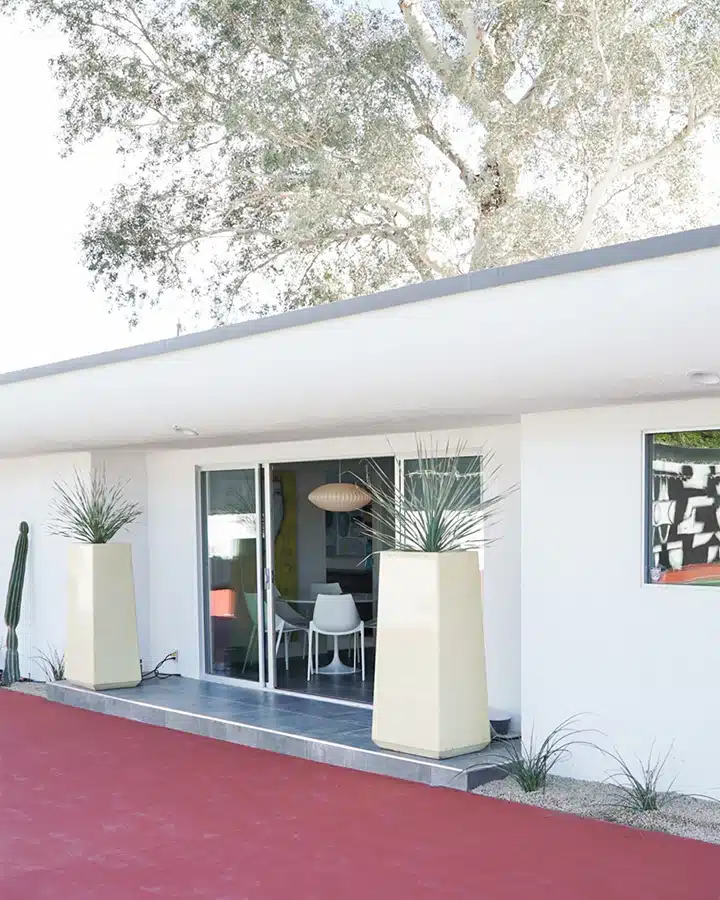 1602-2018-04011474386071675761-720x900 A house with trees in the background