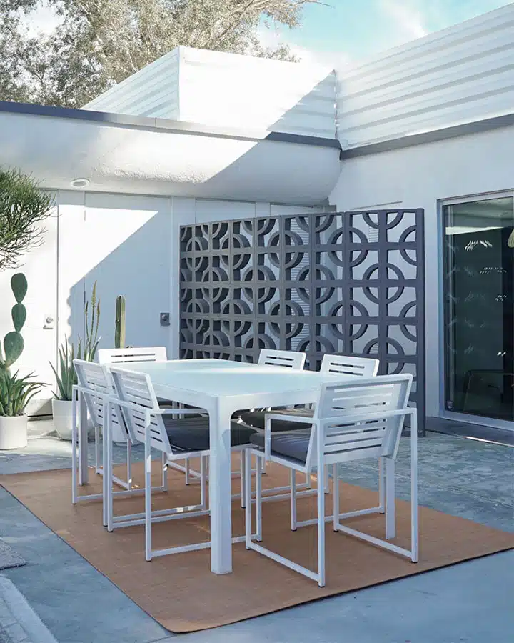 1602-2018-04391474184862926967_720X900 A chair sitting in front of a building