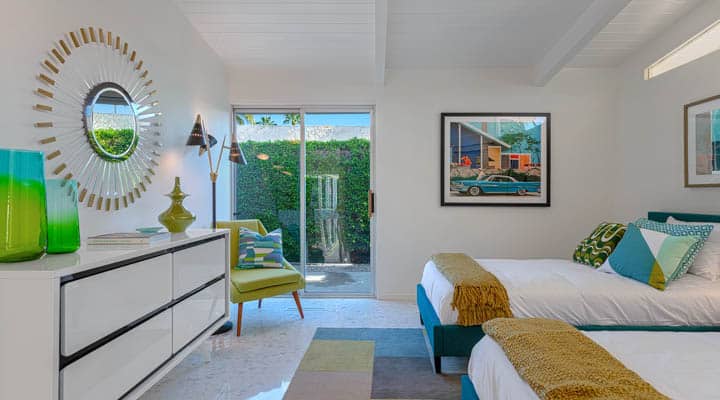 A bedroom with a bed in a room