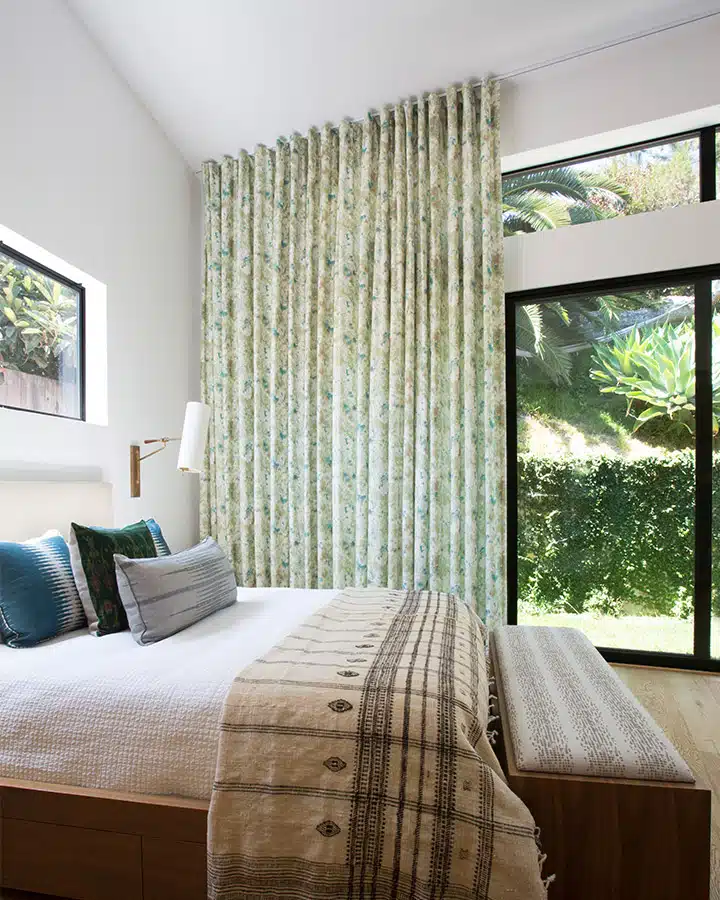 17_620A0062_edited_-720x900 A bedroom with a large bed in a room