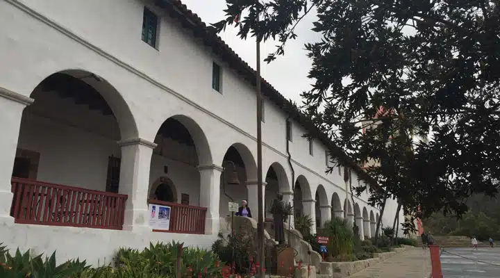 2016-07-12-10.10.29 A group of people walking in front of a building