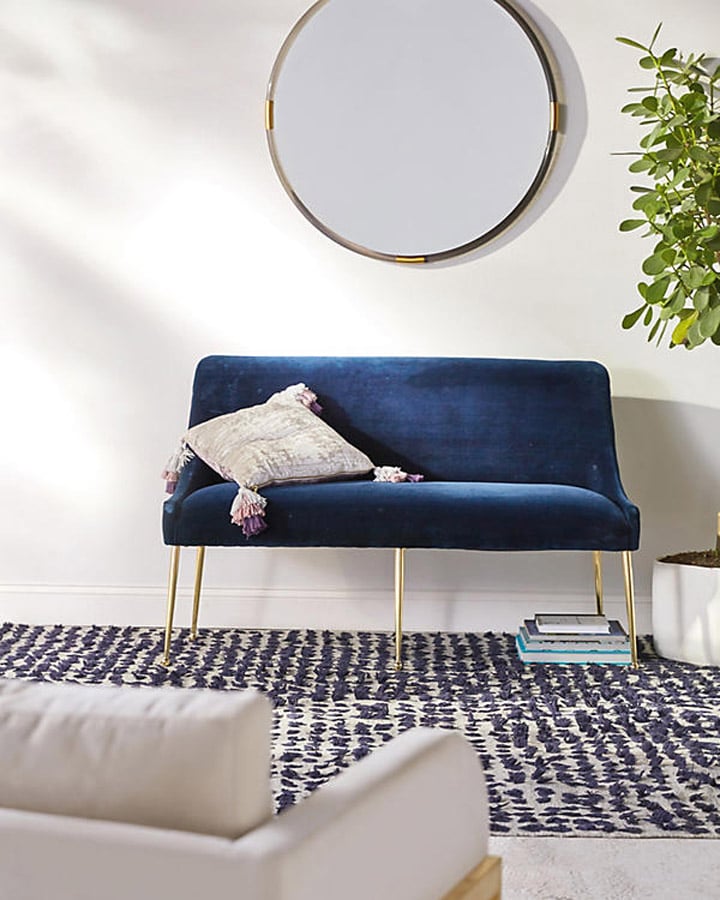 A living room with a couch and a chair