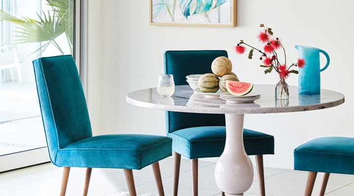 A table topped with a blue chair