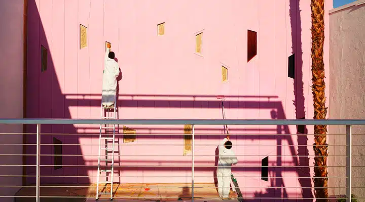 443A1064 A group of people standing in front of a building