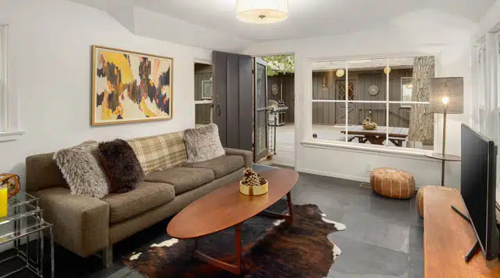 45-print-BLBigRock1020_055-720x400 A living room filled with furniture and a fire place