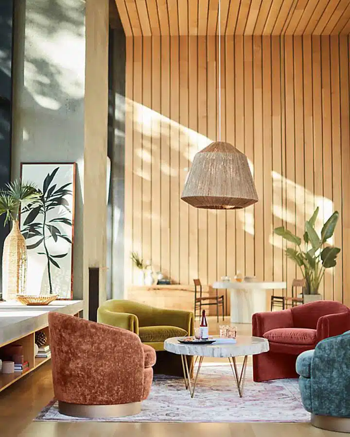 54277603_071_b14_co_habitants-720x900 A living room filled with furniture and a large window