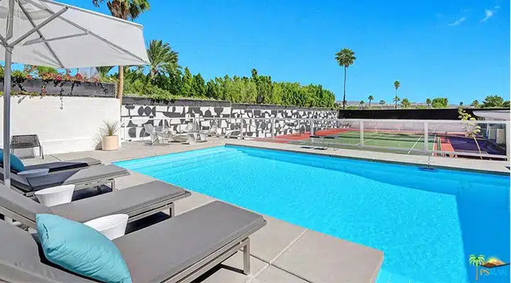 5aa0c1c671a60943c852bec4-720x400 A pool table with a blue umbrella