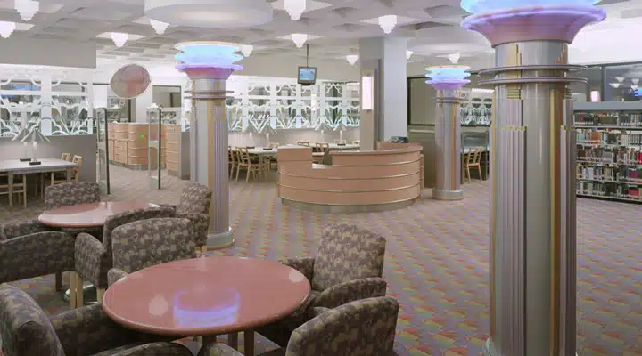 7f8071_c8811f2895be4126be53b8fceeef95a0 A living room filled with furniture and a large window