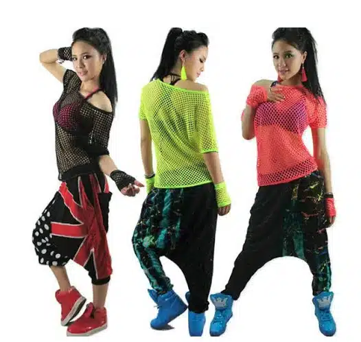 90s_hiphop_fashion A group of young children standing next to a person