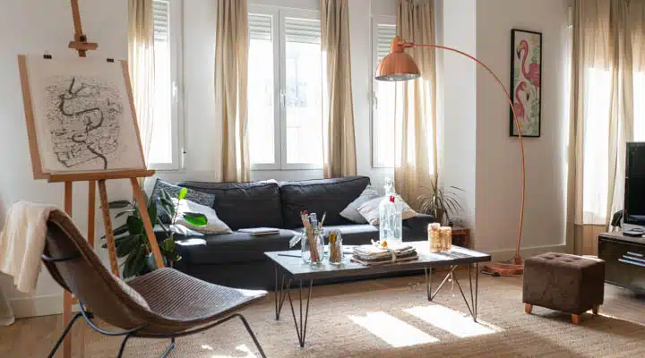 Light modern room decorated for Christmas A living room filled with furniture and a large window