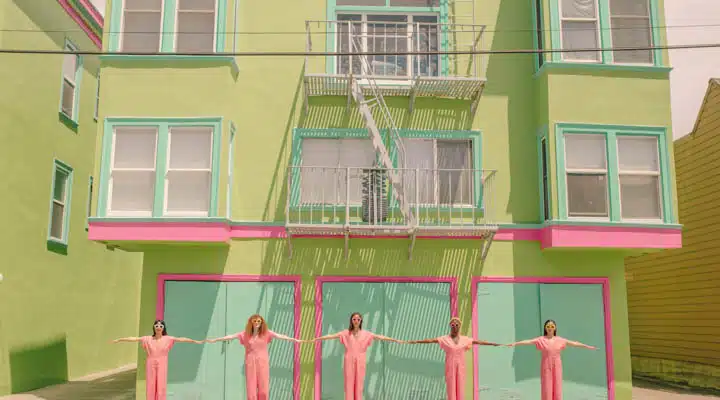 Lined Up A little girl standing in front of a building