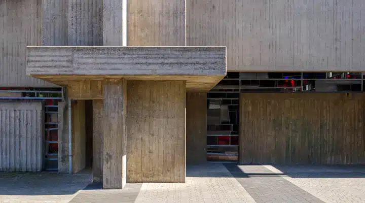 AdobeStock_382270078-720x400 A person sitting on the side of a building