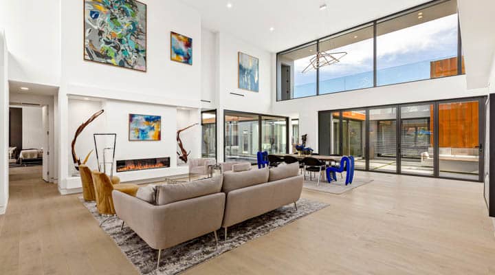 A living room filled with furniture and a large window