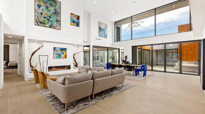 Armoniosa-146-720x400 A living room filled with furniture and a large window