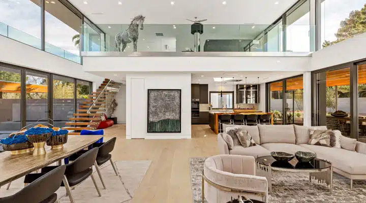 Armoniosa-151-720x400 A living room filled with furniture and a large window