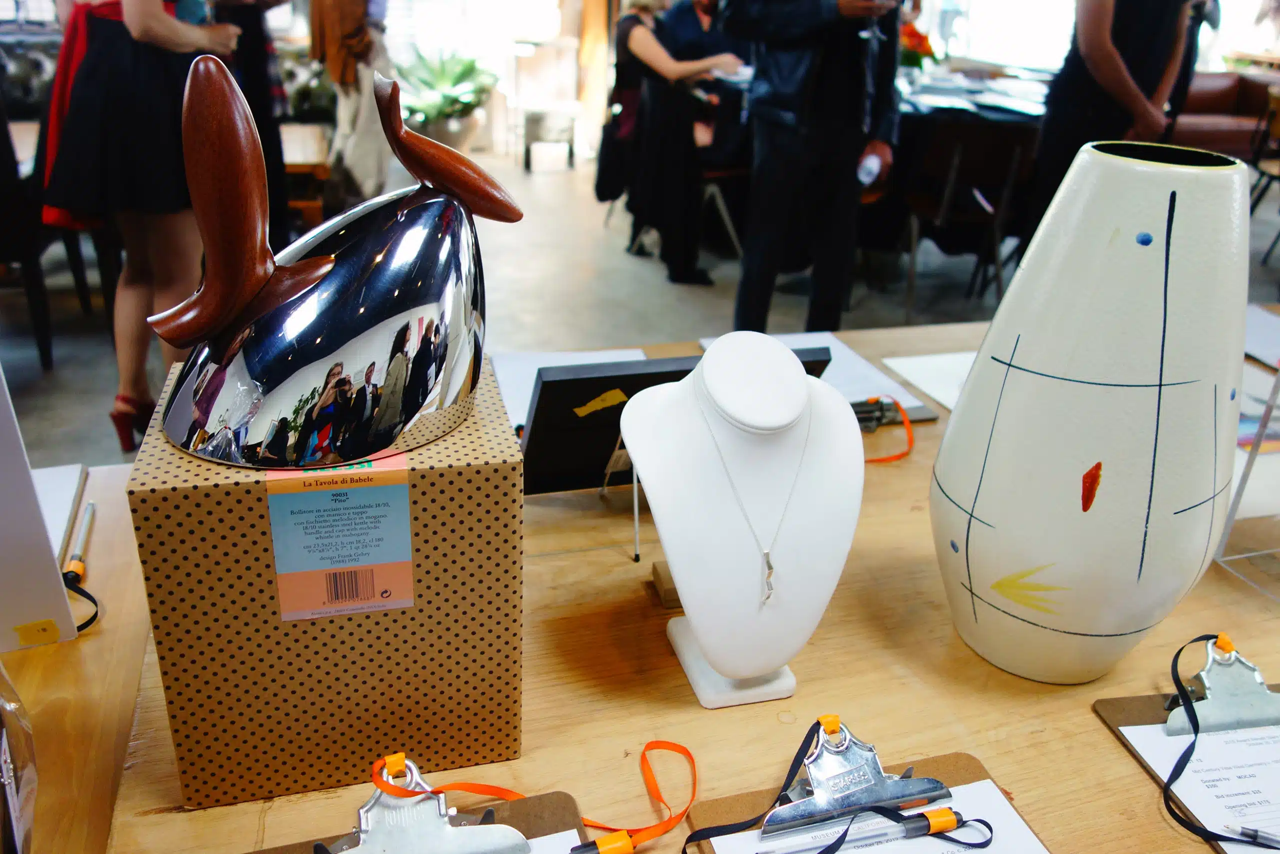 Auction_Items A group of people sitting at a desk