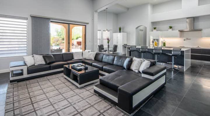 A living room filled with furniture and a large window