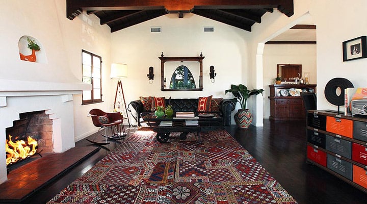 A living room filled with furniture and a fire place