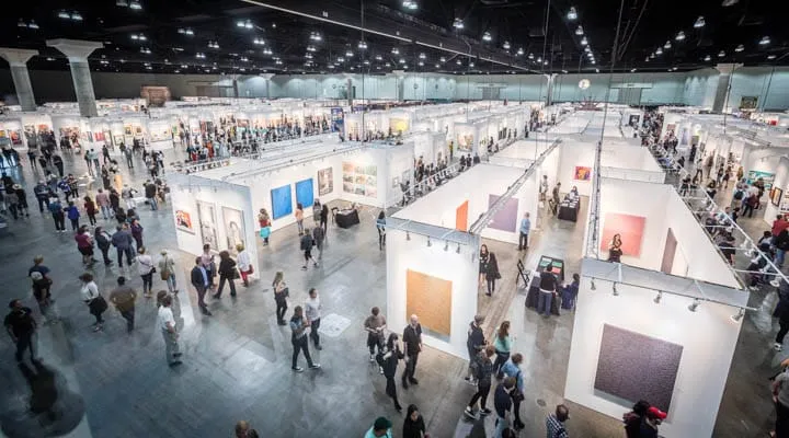 Birdman_Photo_1-720x400 A group of people standing in front of a crowd