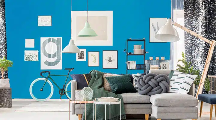 Living room with oversize lamp A living room with a couch and a chair