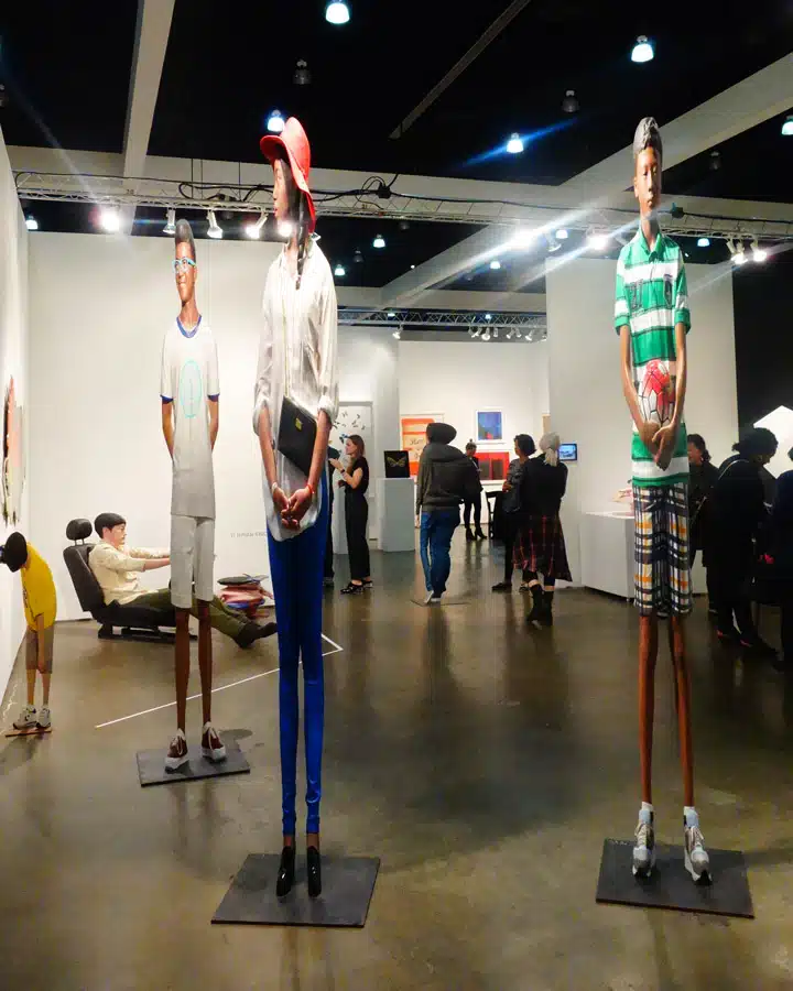 Bus-Stop-2 A group of people standing in a room