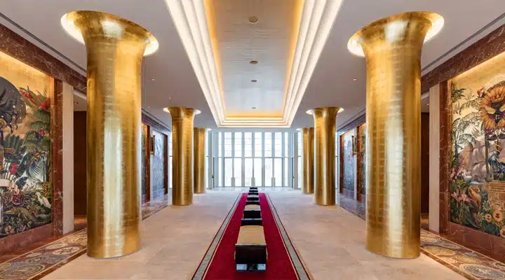 Cathedral-Entrance_-Faena-Hotel-Miami-Beach-photo-credit-Kris-Tamburello A room filled with furniture and a fireplace