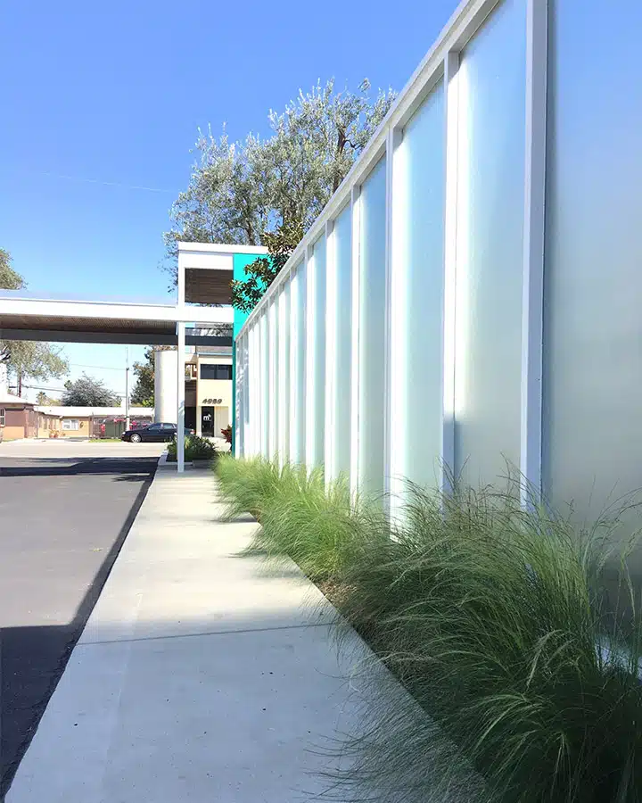 Clock-3-720x900 A train is parked on the side of a building