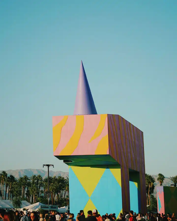 Coachella-4 A group of people flying a kite in a city