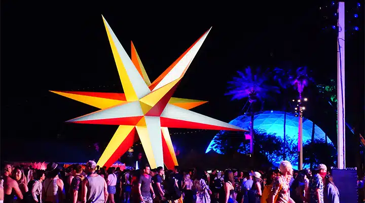 Coachella-8_720x400 A group of people on a stage in front of a crowd