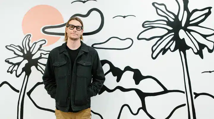 Collier_20200213_12463_PRINT-720x400 A person standing next to a tree