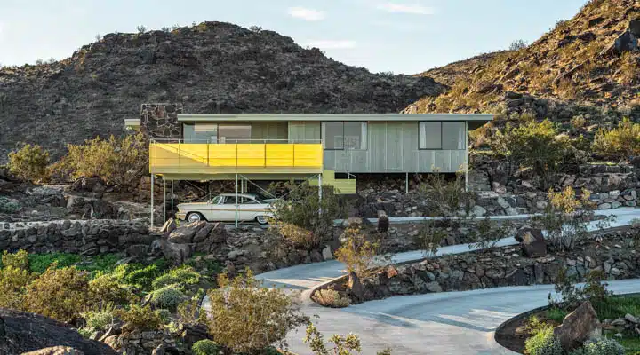 Cree_House_Front_3-720x400 A stone building with a mountain in the background