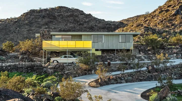 Cree_House_Front_3-720x400 A stone building with a mountain in the background
