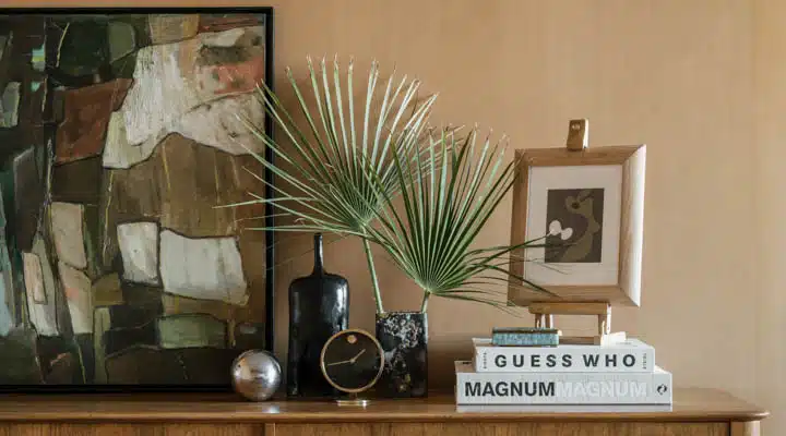 Cree_House_Room_3-720x400 A room filled with furniture and vase on a table