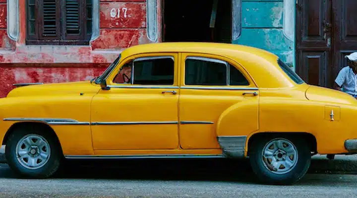 Cuba A car parked on the side of a building