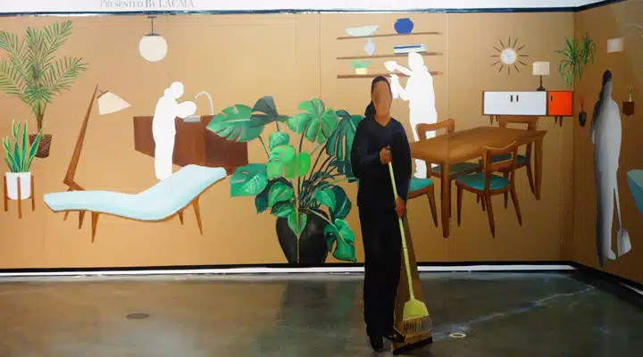 Cutouts A person standing in front of a mirror posing for the camera