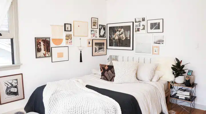 DSC00019_M-720x400 A cat sitting on top of a bed