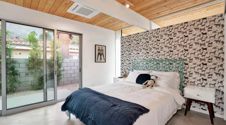 DSC00557-720x400 A bedroom with a bed and a window