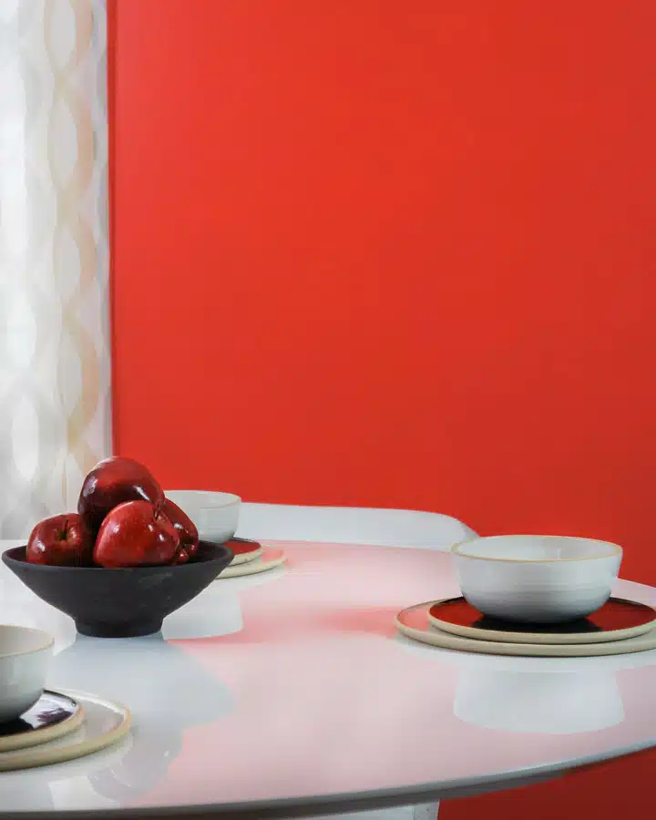 DSC01215 A plate topped with a vase of flowers on a table