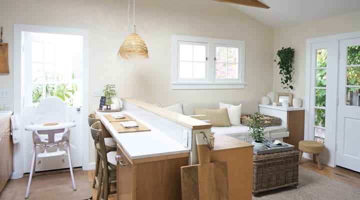 A living room filled with furniture and a large window