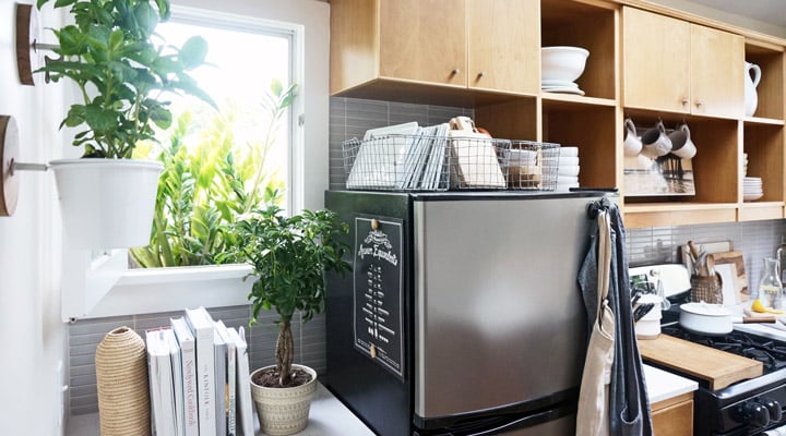 A kitchen with a pot on a table