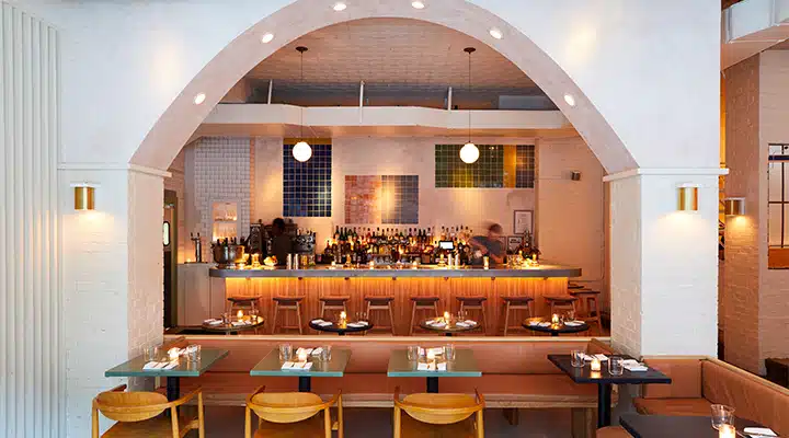 De-Maria-Interior-Alcove-view-_credit_-Nicole-Franzen_-720x400 A dining room table in front of a window