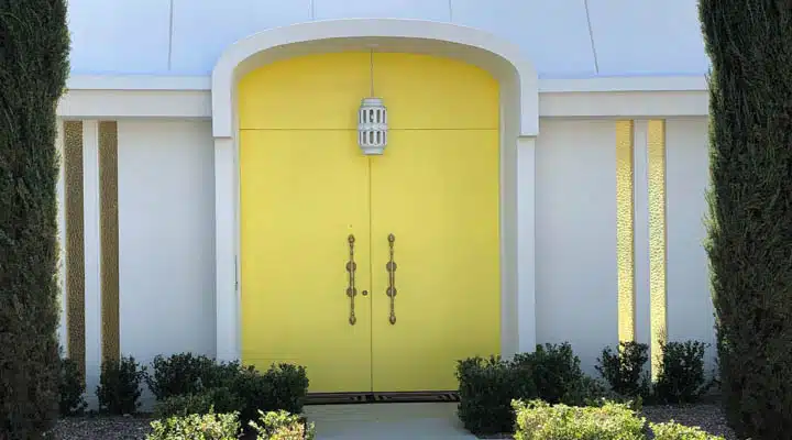 Door_Tour_9-720x400 A close up of a flower garden in front of a building