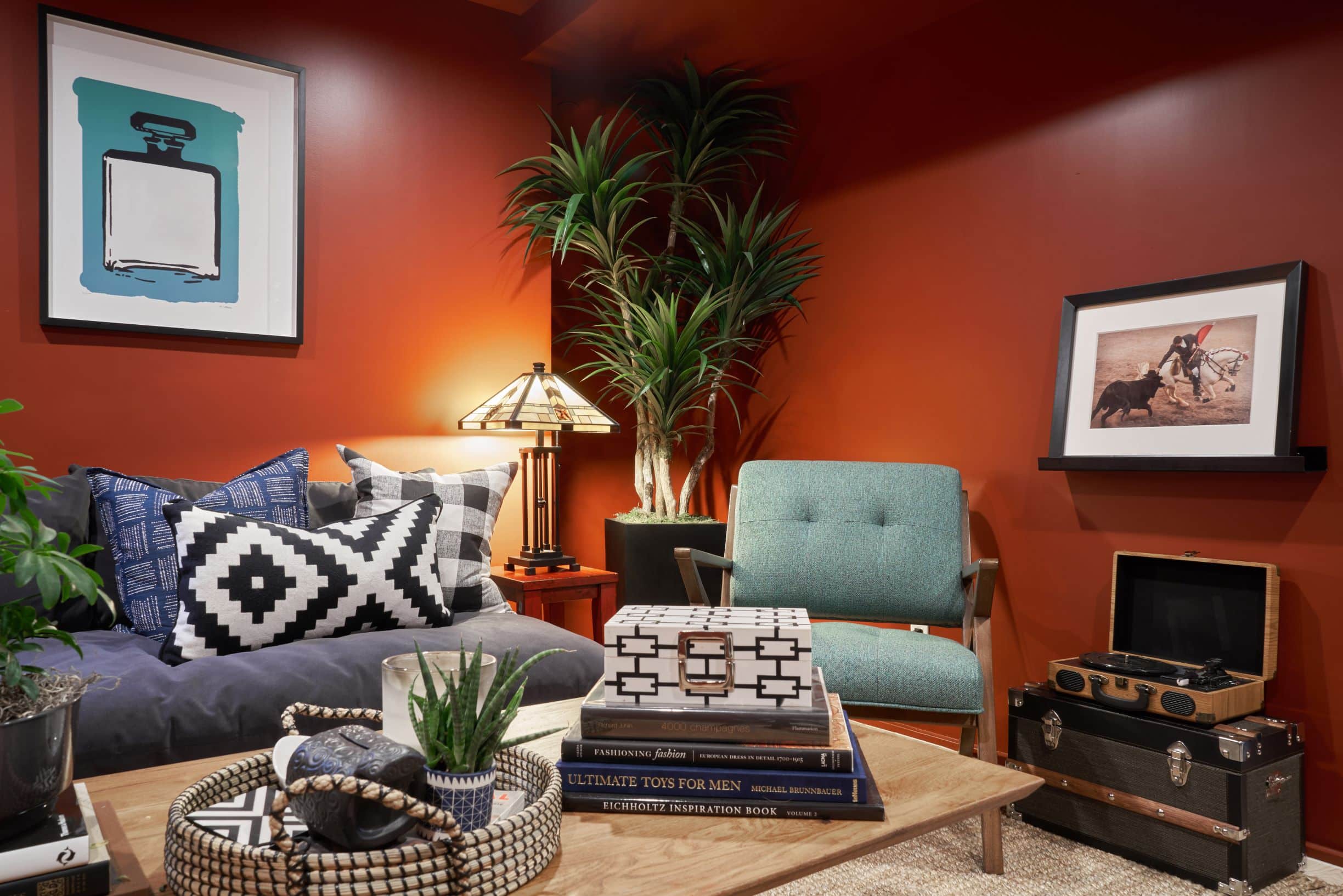 A living room filled with furniture and vase of flowers on a table