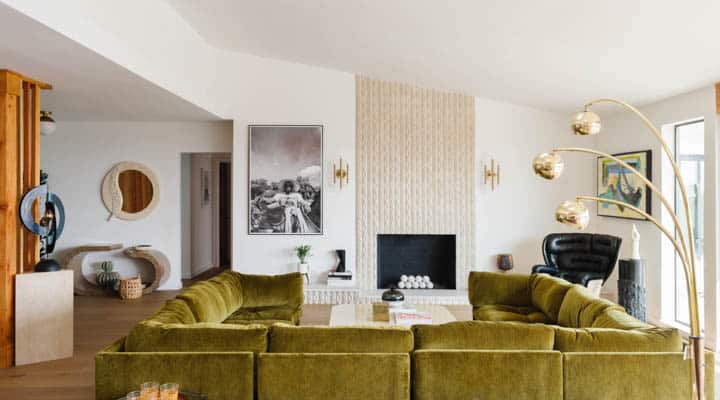 A living room filled with furniture and a fire place